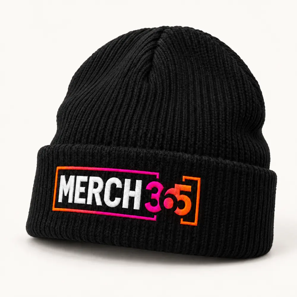Black knit beanie with Merch365 branding on a warm white studio background — concept