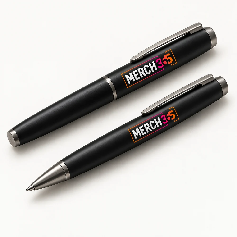 Pens with Merch365 branding on a warm white studio background — concept