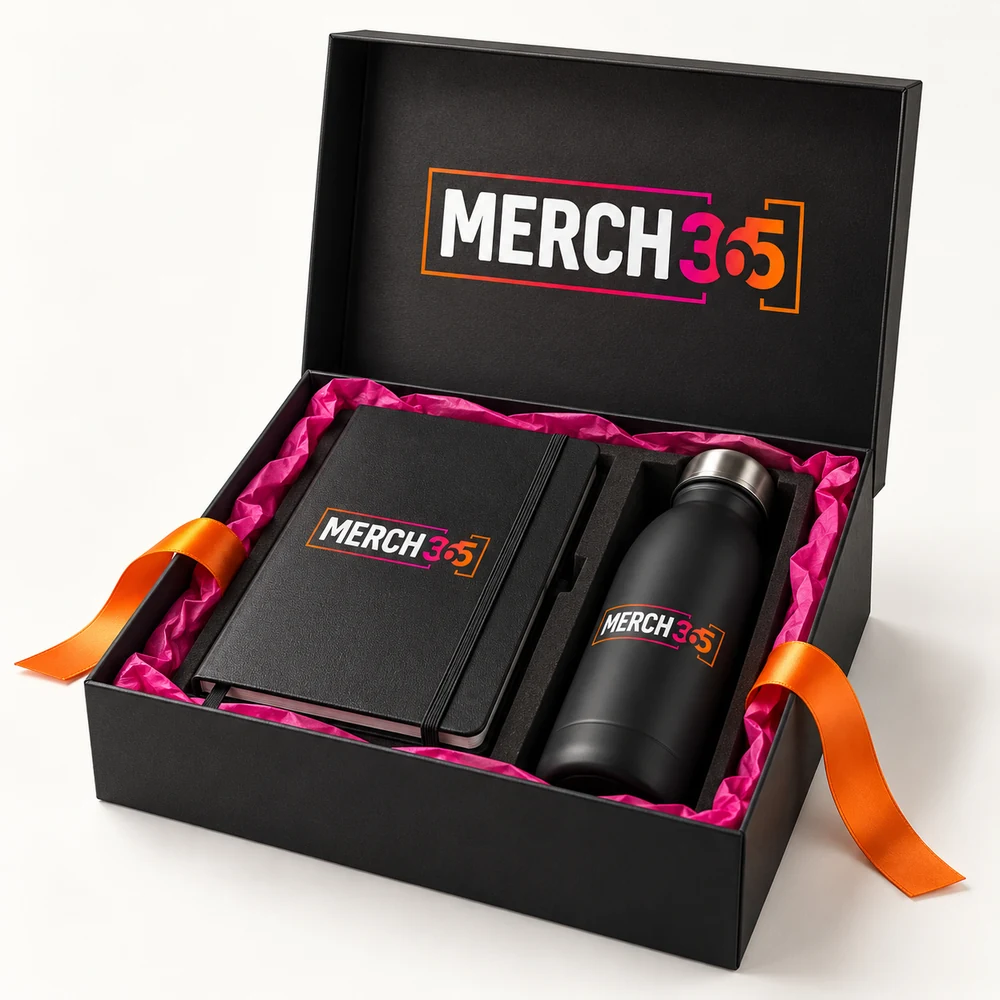 Premium gift boxes with Merch365 branding on a warm white studio background — concept